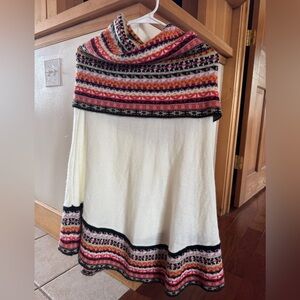 Alpaca wool knitted turtleneck poncho sweater.